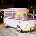 Vintage Food Truck With Colorful Striped Roof White Body And Yellow Front