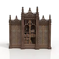 Ornate Carved Bookcase With Gothic Spires Glass Doors And Books Inside