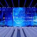 Stage Setup With Blue Lighting Large Screen And Audience Seats 3d model