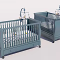 Two Blue Wooden Baby Cribs With Decorative Mobiles and Drawers for Nursery