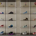 Modern Glass Shoe Display Cabinet With Sneakers Hats And Trophies On Shelves