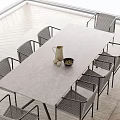 Modern Outdoor Table With Metal Frame And Rattan Chairs For Garden Patio Use