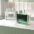 Kitchen Countertop Decorative Ornament Set With Green And White Knife Holders On Marble Surface