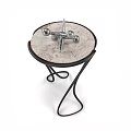 Modern Black Leisure Chair With Curved Metal Frame And Side Table Decor
