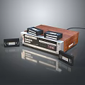 Vintage Cassette Player With Wooden Panel And Cassette Tapes On Reflective Surface