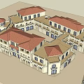 Commercial Street Featuring Connected Buildings Red Tiled Roofs Arched Windows And Courtyard