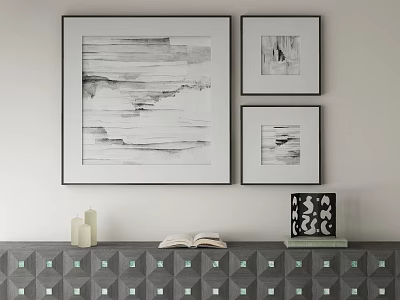 Black And White Abstract Paintings Hanging On Wall Above Geometric Pattern Cabinet With Candles Book And Decor 3d model