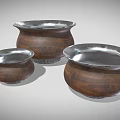 Three Wooden Ceramic Vessels With Silver Rimmed Open Tops And Textured Bodies