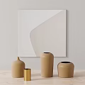 Decorative Ornament Set on Wooden Table with Abstract Painting Including Yellow Cylinder and Brown Vases