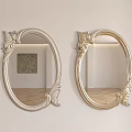 Oval Mirrors With Carved Decorations Hung On Light Colored Wall Reflecting Room Interior Wooden Floor
