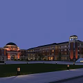 Traditional Red Brick School Building With Dome Tower Main Entrance Lawn And Pathway At Dusk