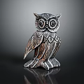 Intricate Carved Metallic Owl Decorative Figurine Set With Feather Details On Black Display Surface