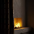 Cozy Fireplace With Burning Fire In Textured Stone Wall And Wooden Sliding Screen