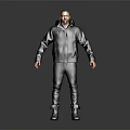 Man In Dark Hooded Jacket And Pants Standing On Gray Background With Boots