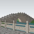 Traditional Stone Arch Bridge With Stone Railing Over Water Surrounded By Trees And Sunset Sky