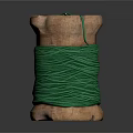 Wooden Spool Wound With Green Thread And Needle Against Dark Background