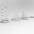 Playground Equipment With Silver Metal Spiral Structures In Various Shapes