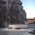 White Curved Irregular-Shaped Sofa In Rocky Cliff Setting With Central Fire Pit And Natural Surroundings