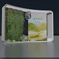 Art Installation With White Frame Featuring Lush Green Plants And Green Living Information