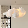 Cloud Shaped White Chandelier Illuminated Glowing Light In Modern Room With Glass Partition And Shelf