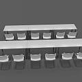 Two Long Conference Tables with White Armrest Chairs and Black Metal Legs