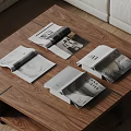 Open Magazines on Wooden Coffee Table with Pages Showing Images and Text