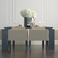 Elegant Dining Table Set with Beige Upholstered Chairs White Flower Vase and Wine Glasses