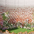 Garden Landscape With Red Brick Wall Green Plants Flowers Wooden Fence And Pebble Ground