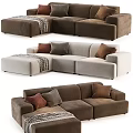 Modern Sectional Sofa with Decorative Pillows and Throw Blanket in Neutral Tones
