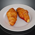 Golden Flaky Croissants Placed On A White Plate For Morning Meal