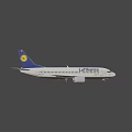 White Lufthansa Airplane With Blue Tail Flying In Sky