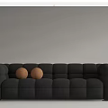 White and Black Sectional Sofa with Square Tufted Design and Two Brown Balls 3d model