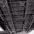 Modern Industrial Ceiling Design With Exposed Metal Grid Framework And Supports