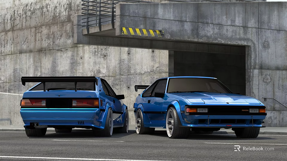 Two Blue Sports Cars Parked Near Concrete Structure With Tunnel Entrance And Yellow Warning Stripes 3d model 