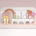 Chic Perfume And Cosmetics On Modern Display Stand With Soft Pink Orange Decor