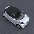 White Compact Electric Car With Modern Design And LED Headlights In Outdoor Building Setting