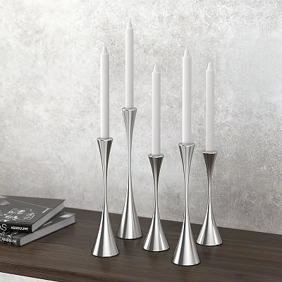 Silver Candle Holders Set On Wooden Table With Books And Gray Wall Background 3d model