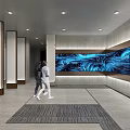 Modern Exhibition Hall Featuring Large Blue Wavy Screen Person Standing Gray Walls and Large Windows