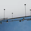 Black Ceiling Mounted Lighting Fixture Set With Multiple Adjustable Lights And Blue Wall 3d model