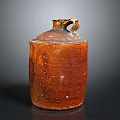 Handcrafted Brown Textured Pottery Sculpture With Top Handle And Artisanal Details