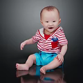 Cute Baby Sitting On Black Reflective Surface Wearing Red White Striped Shirt Blue Shorts Smiling