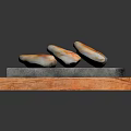 Three Crispy Golden Fried Dumplings on Stone Slab in Wooden Tray