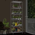 Balcony Decor with Hanging Basket Plants on White Multi-tiered Stand and Green Vine Wall