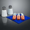 Tableware Set with White Salt Pepper Shakers and Orange Utensils on Blue Placemat