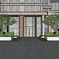 Modern Building Entrance Feature Wall With Glass Doors And Green Plants