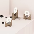 Three Modern Table Lamps With Wooden Base And Ring Shaped Light On Tabletop