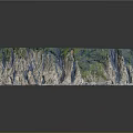 Mountainous Terrain With Blue Gray Rocky Layers Canyon Green Vegetation And Textured Surface