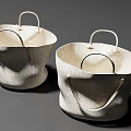 Two Woven Storage Baskets with Natural Material Handles and Simple Modern Design