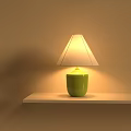 Illuminated Green Base Table Lamp With White Lampshade On White Shelf Beige Wall