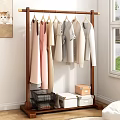 Organized Closet With Hanging Clothes In Soft Colors And Storage Boxes
